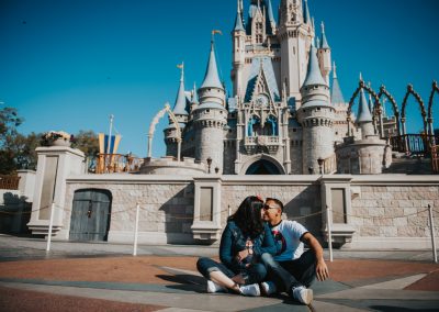 kissing couple in front of castle